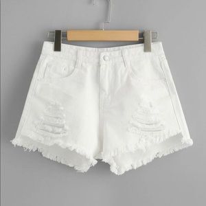 White ripped jean shorts